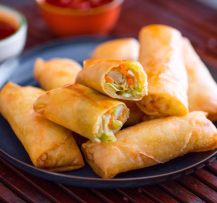 Crispy golden Spring Rolls served with dipping sauce