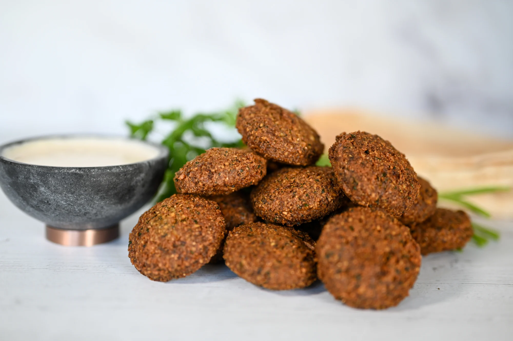 Freshly fried falafel inside a fluffy pita with vegetables 