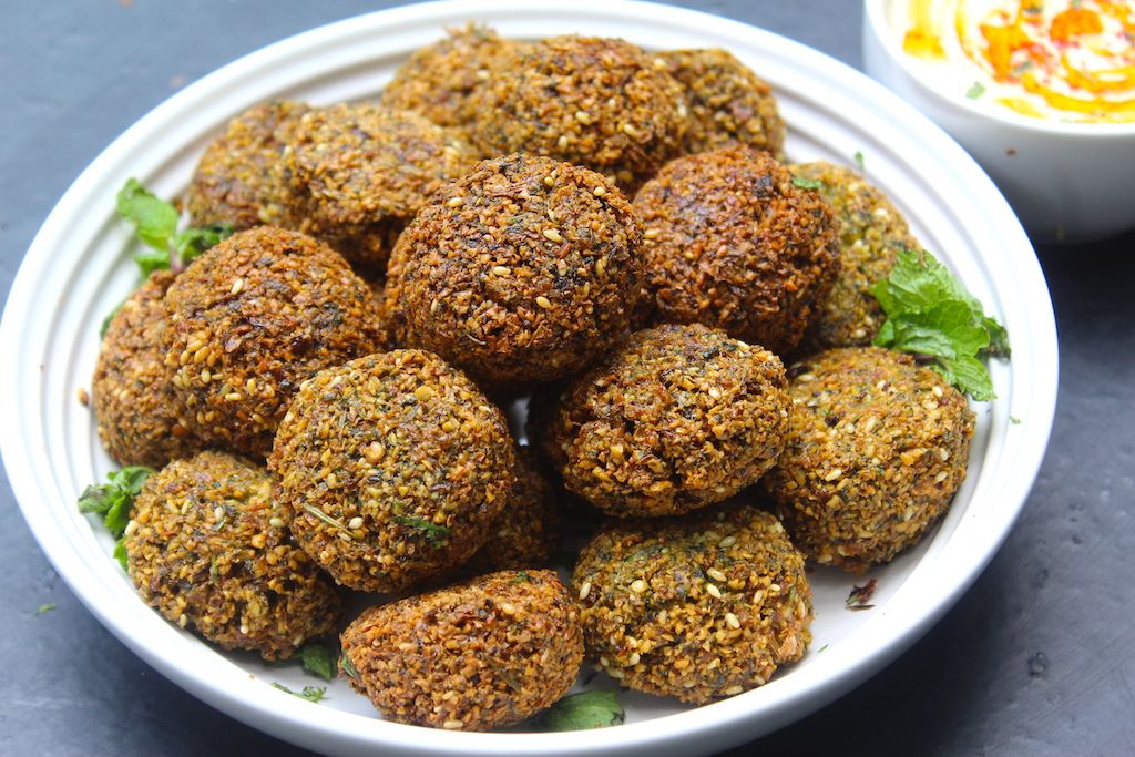 Middle Eastern falafel platter with hummus and pickles 